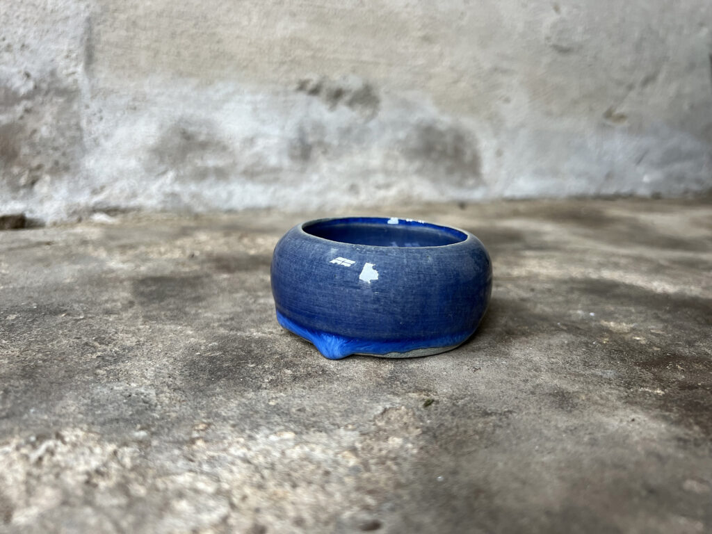 glossy blue round bowl