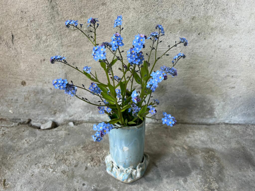 blue colored ceramics vase