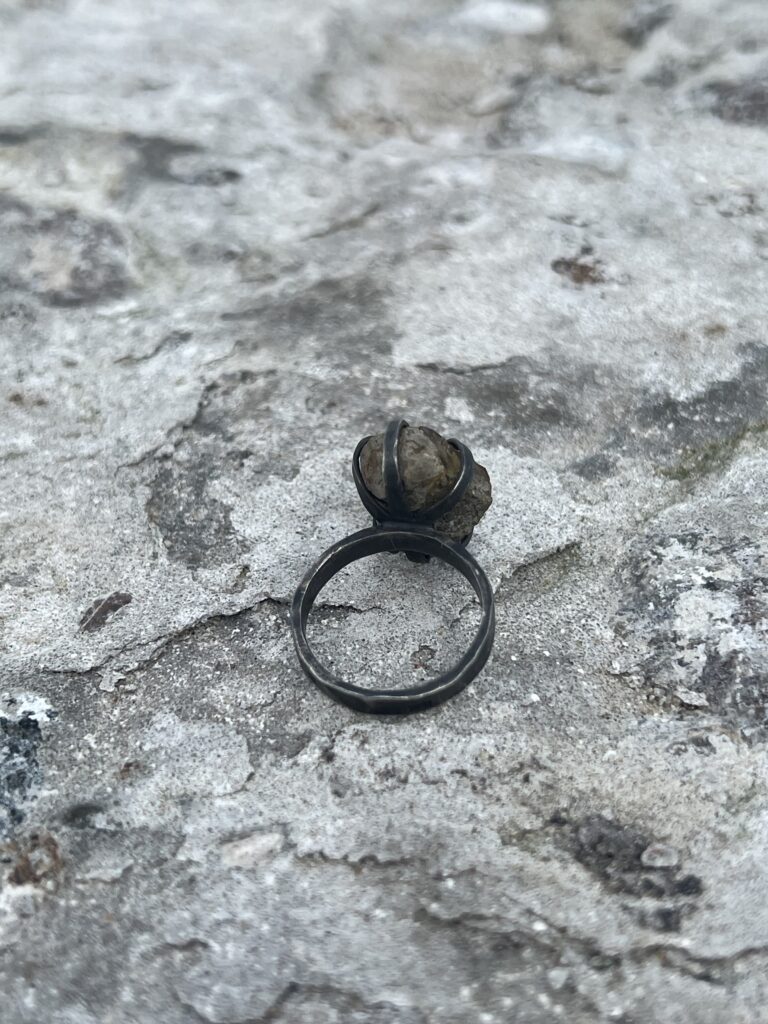 oxidized silver ring with raw opal set on top